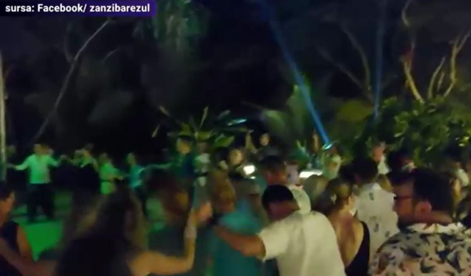 Petrecere românească pe o plajă din Zanzibar. Horă pe muzică machedonească, printre palmieri 